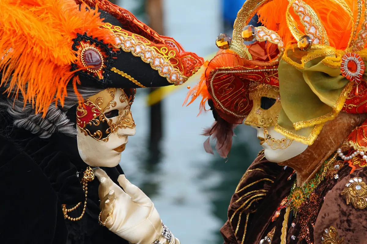 Masked figures at the Venice Carnival